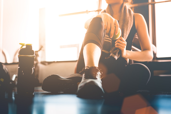 bigstock-Sport-Woman-Sitting-And-Restin-214652356