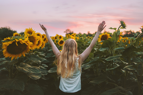 bigstock-Woman-Happy-Raised-Hands-In-Su-336895108