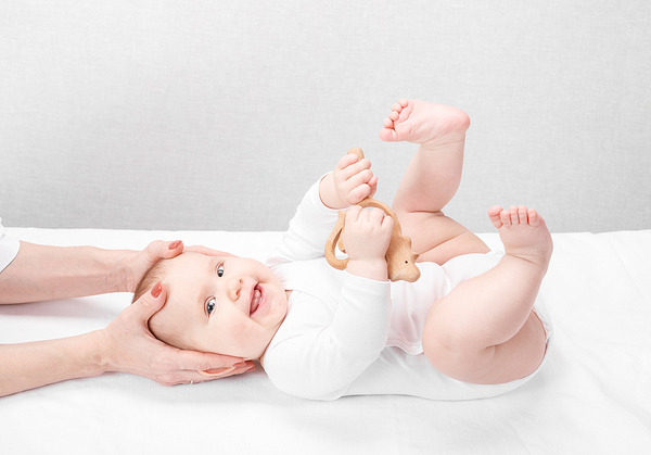 bigstock-Six-month-baby-girl-receiving-338718664
