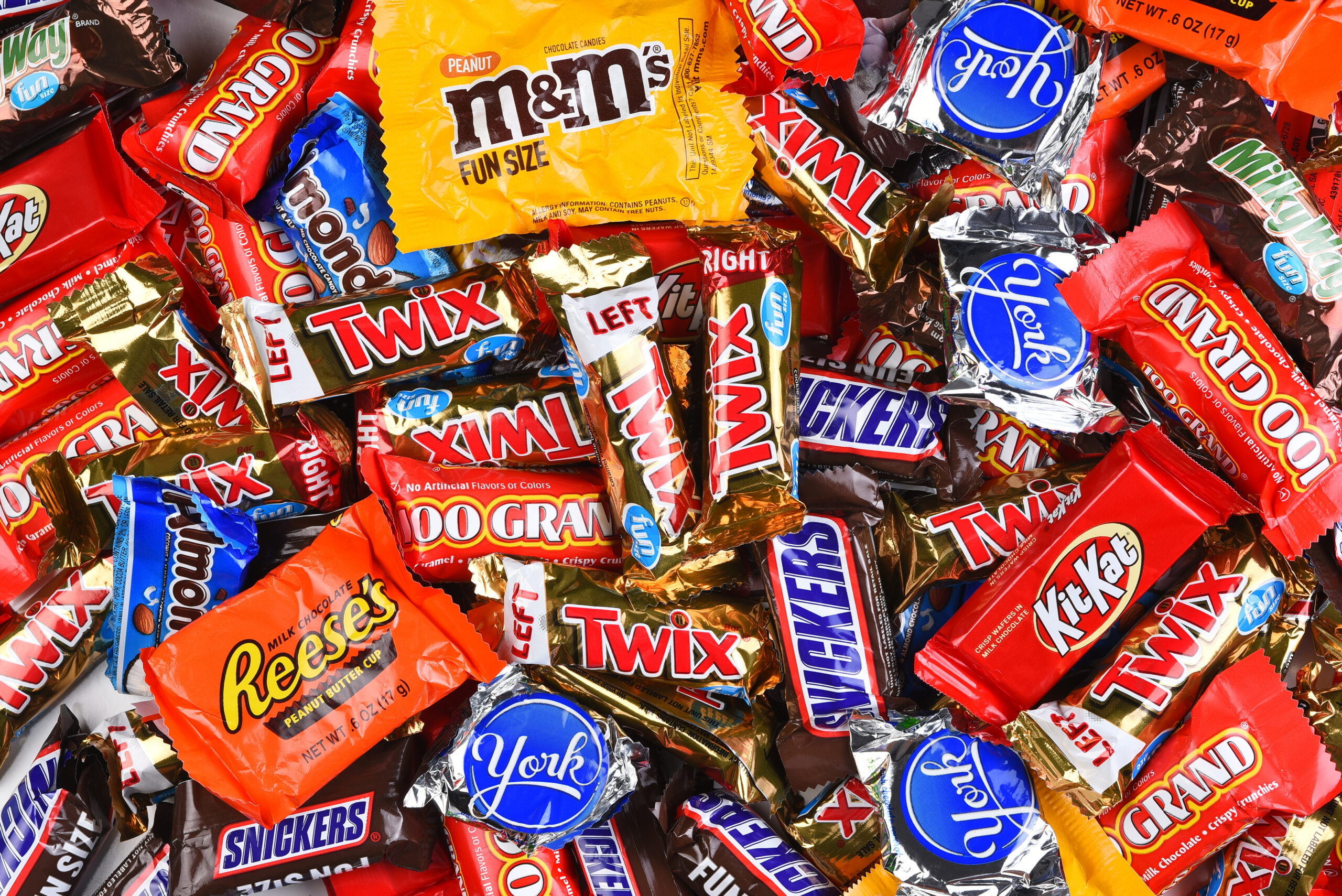IRVINE, CALIFORNIA - 23 SEPT 2021: A large assortment of fun size candy bars for Halloween.